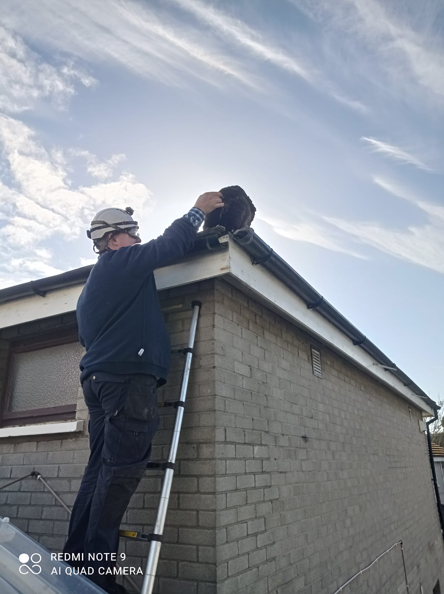 Dublin Trades roofer working on gutters